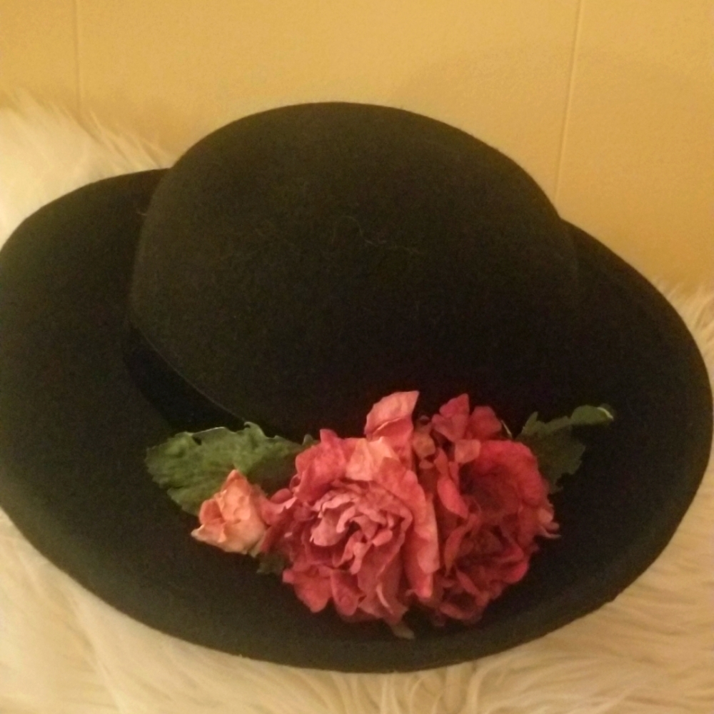 Beautiful black brim wool hat. With eye catching flower on black ribbon..